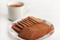 Wheat Coconut biscuits in white plate, Indian biscuits popularly known as Chai-biscuit in India, chai or chaha in india. Tea Time