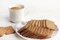 Wheat Coconut biscuits in white plate, Indian biscuits popularly known as Chai-biscuit in India, chai or chaha in india. Tea Time