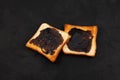 Wheat crispy toast with brown spread, top view. Toasted slices of bread for breakfast. Dark background, copy space Royalty Free Stock Photo