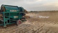 Threasure while threshing wheat crop in rural punjab Royalty Free Stock Photo