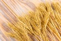 Wheat Ears on the Wooden Table. Sheaf of Wheat over Wood Background. Harvest concept Royalty Free Stock Photo