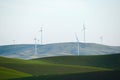 wheat farm hill with wind mill Royalty Free Stock Photo