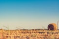 Wheat field, after harvesting. Large bales of hay and cut stalks of wheat. The golden colors of late summer and early autumn. Royalty Free Stock Photo