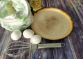 Wheat flour, milk, chicken eggs, vegetable oil, frying pan and whisk for whisking on a wooden table Royalty Free Stock Photo