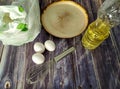 Wheat flour, milk, chicken eggs, vegetable oil, frying pan and whisk for whisking on a wooden table Royalty Free Stock Photo