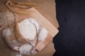 wheat flour in sacks With wheat ears on the table, black background