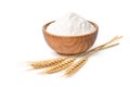 Wheat flour in wooden bowl with wheat spikelets Royalty Free Stock Photo