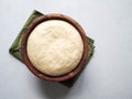 Wheat flour yeast dough in wooden bowl. Top view. Copy space Royalty Free Stock Photo