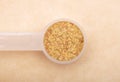 Wheat germs in measuring spoon on brown background Royalty Free Stock Photo