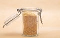 Wheat germs in open jar on brown background Royalty Free Stock Photo