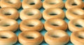 Wheat golden bagels on a blue background.