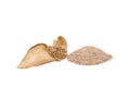 Wheat grains on a dry corn leaf with a handful of wheat bran cut on a white background