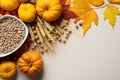 Wheat grains in a mug, spikelets, pumpkins and maple leaves on a white background, top view Royalty Free Stock Photo