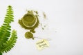 Wheat grass green powder is a healthy supplement to add vitamins and minerals to your diet. Royalty Free Stock Photo