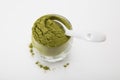 Wheat grass green powder is a healthy supplement to add vitamins and minerals to your diet. Royalty Free Stock Photo