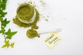 Wheat grass green powder is a healthy supplement to add vitamins and minerals to your diet. Royalty Free Stock Photo