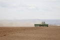 A farmer in a field, planting wheat. Royalty Free Stock Photo