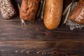 Wheat products on dark wooden. Bread and loaf. Carbohydrates. Royalty Free Stock Photo