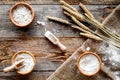 Wheat and rye ear for flour production on wooden desk background top view Royalty Free Stock Photo