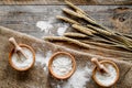 Wheat and rye ear for flour production on wooden desk background top view Royalty Free Stock Photo