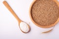 Wheat seeds grains in wooden bowl near with flour in spoon spatula and with ear of wheat, top view, flat lay Royalty Free Stock Photo