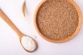 Wheat seeds grains in wooden bowl near with flour in spoon spatula and with ear of wheat, top view, flat lay Royalty Free Stock Photo