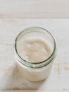 Wheat sourdough starter, top view, copy space Royalty Free Stock Photo