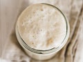 Wheat sourdough starter, top view, copy space Royalty Free Stock Photo