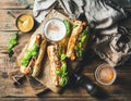 Wheat unfiltered beer and grilled sausage dogs in baguette