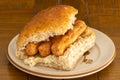 A wheaten and oatmeal roll with scottish Link Sausages