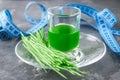 Wheatgrass shot. Juice from wheat grass. Trend of health.