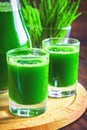 Wheatgrass shot. Juice from wheat grass. Trend of health.