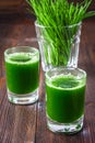 Wheatgrass shot. Juice from wheat grass. Trend of health.