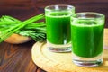 Wheatgrass shot. Juice from wheat grass. Trend of health.