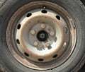 Wheel or automobile disk. View of a gray or silver rim of a car. Fragment of the central part (axle) of an old wheel Royalty Free Stock Photo