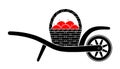 Wheel barrow and basket of apples