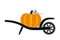 Wheel barrow and pumpkin