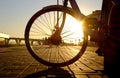 A wheel of bicycle in the evening, the sunset light, winter time, in Saint-Petersbug, Russia