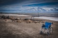 Wheel chair at the beach Royalty Free Stock Photo