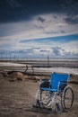 Wheel chair at the beach Royalty Free Stock Photo