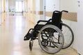 Wheel chair in the hospital corridor. Royalty Free Stock Photo