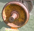 The wheel covered with rust from the car of the old railway