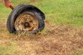 Wheel of destroyed agricultural machinery. Free space to write