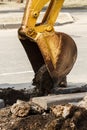 Wheel excavator digging trench on rocky land Royalty Free Stock Photo