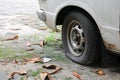 wheel flat tire of the car old and cracked on the road Royalty Free Stock Photo