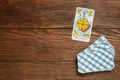 The Wheel of Fortune and other tarot cards on wooden table, flat lay. Space for text Royalty Free Stock Photo