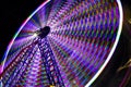 Wheel fun with illumination against dark night sky Royalty Free Stock Photo
