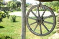 Horse-drawn carriage wheel . Wooden old horse-drawn carriage . The wheel of the horse-drawn carriage hung . Royalty Free Stock Photo