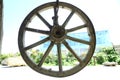 Horse-drawn carriage wheel . Wooden old horse-drawn carriage . The wheel of the horse-drawn carriage hung . Royalty Free Stock Photo