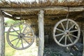 Horse-drawn carriage wheel . Wooden old horse-drawn carriage . The wheel of the horse-drawn carriage hung . Royalty Free Stock Photo